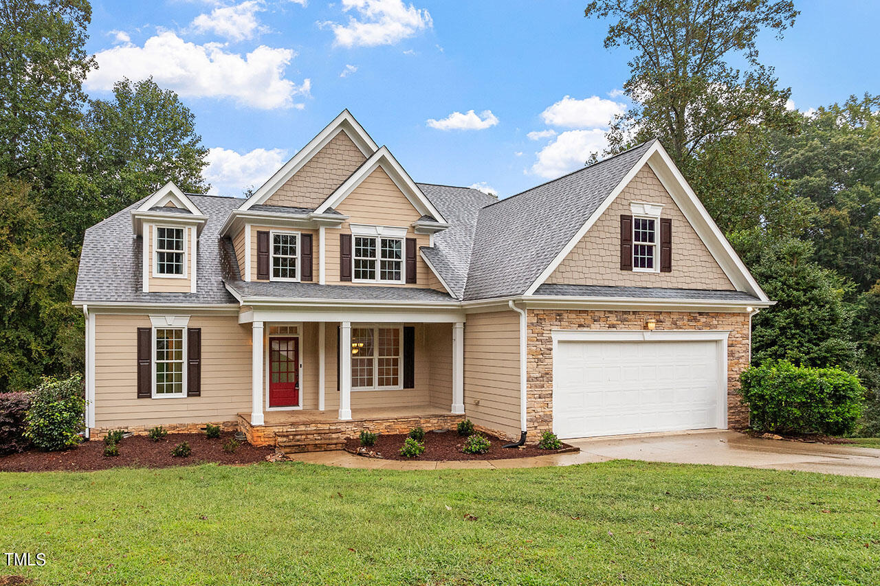 front view of a house with a yard