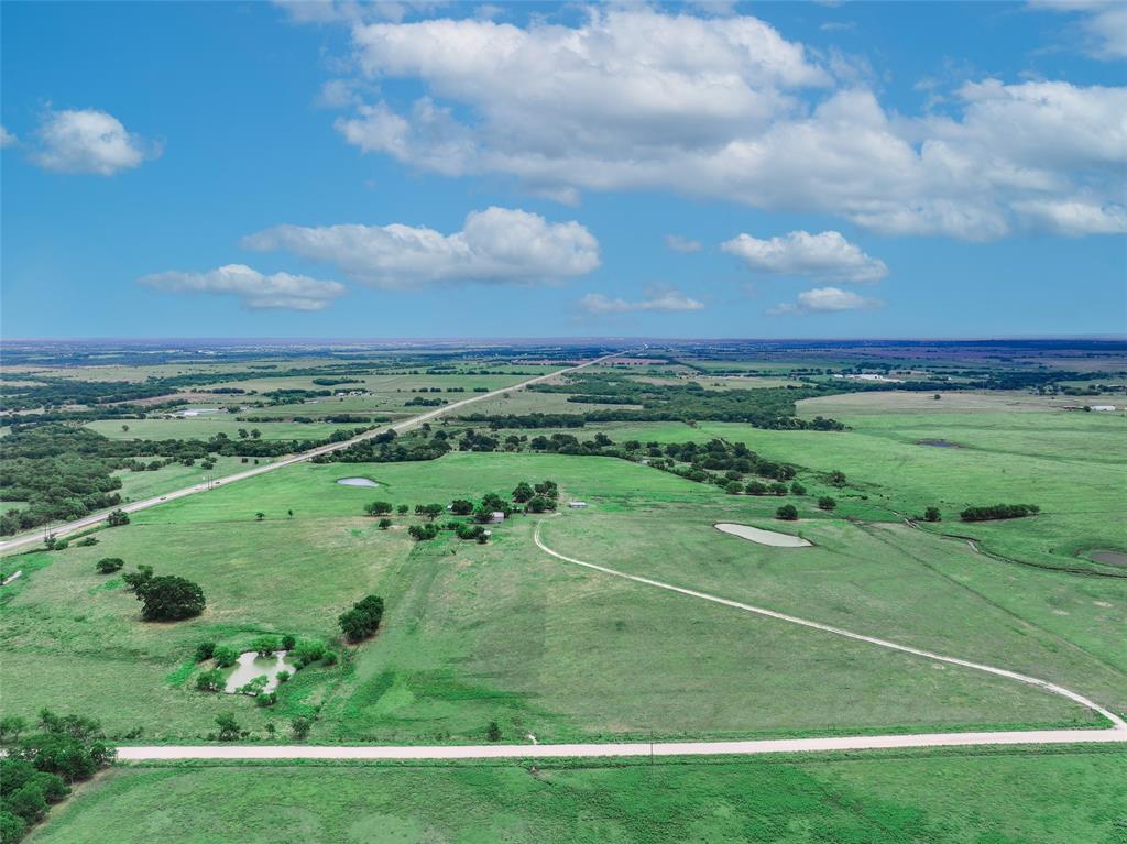 a view of a golf course with a big yard