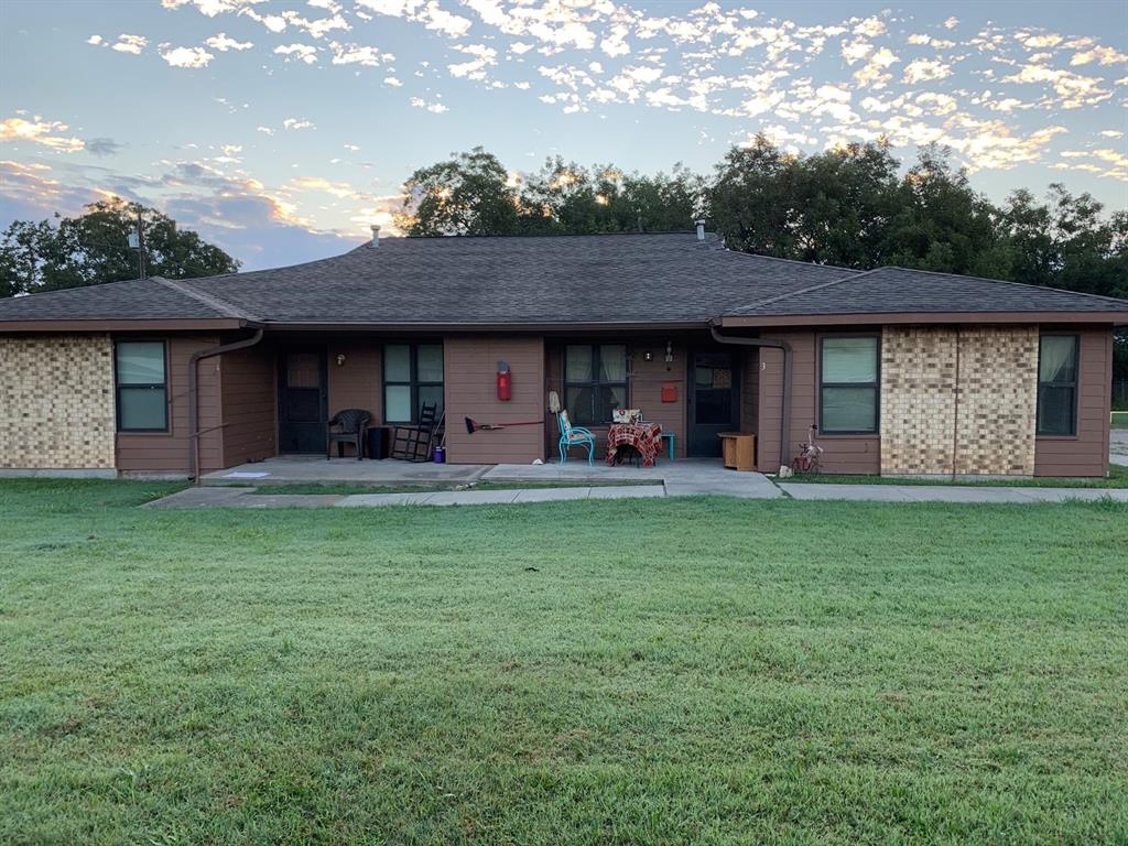 a front view of house with yard and porch