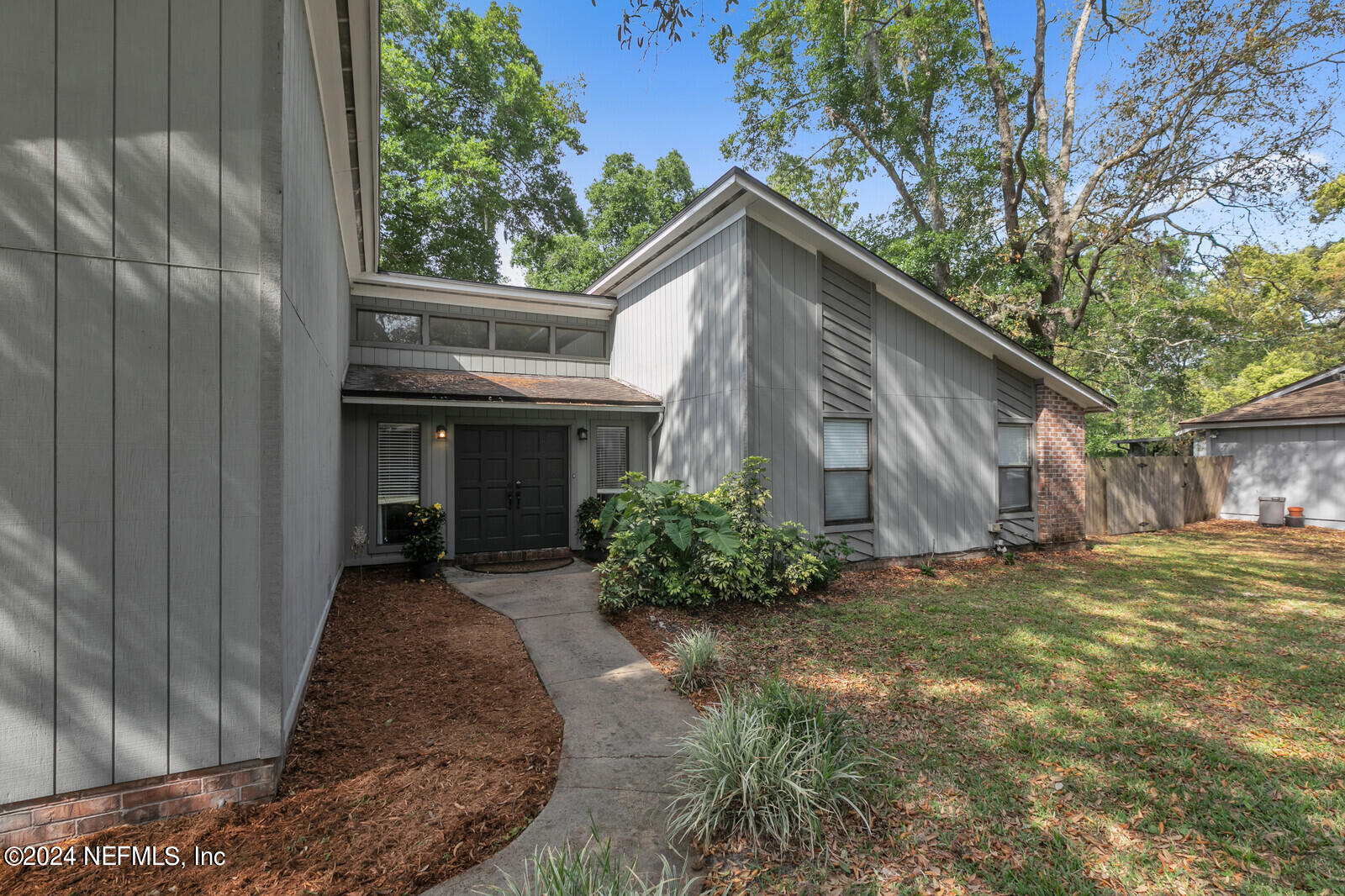 a view of house with yard