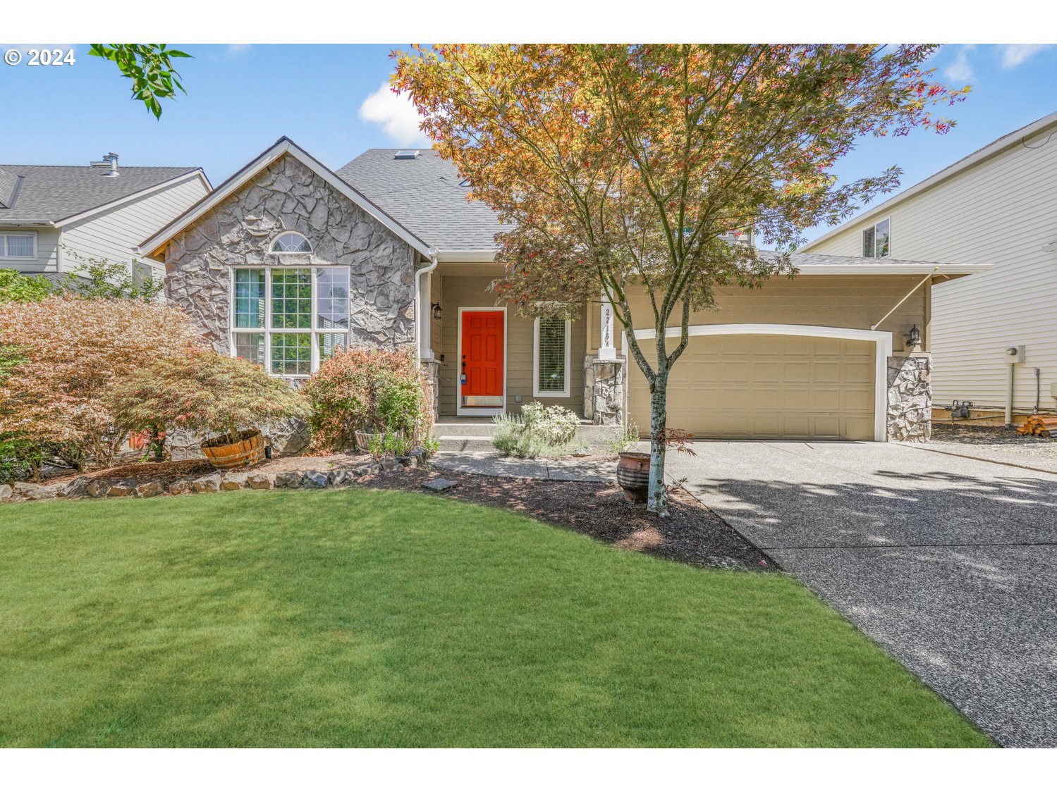 a front view of house with yard and green space