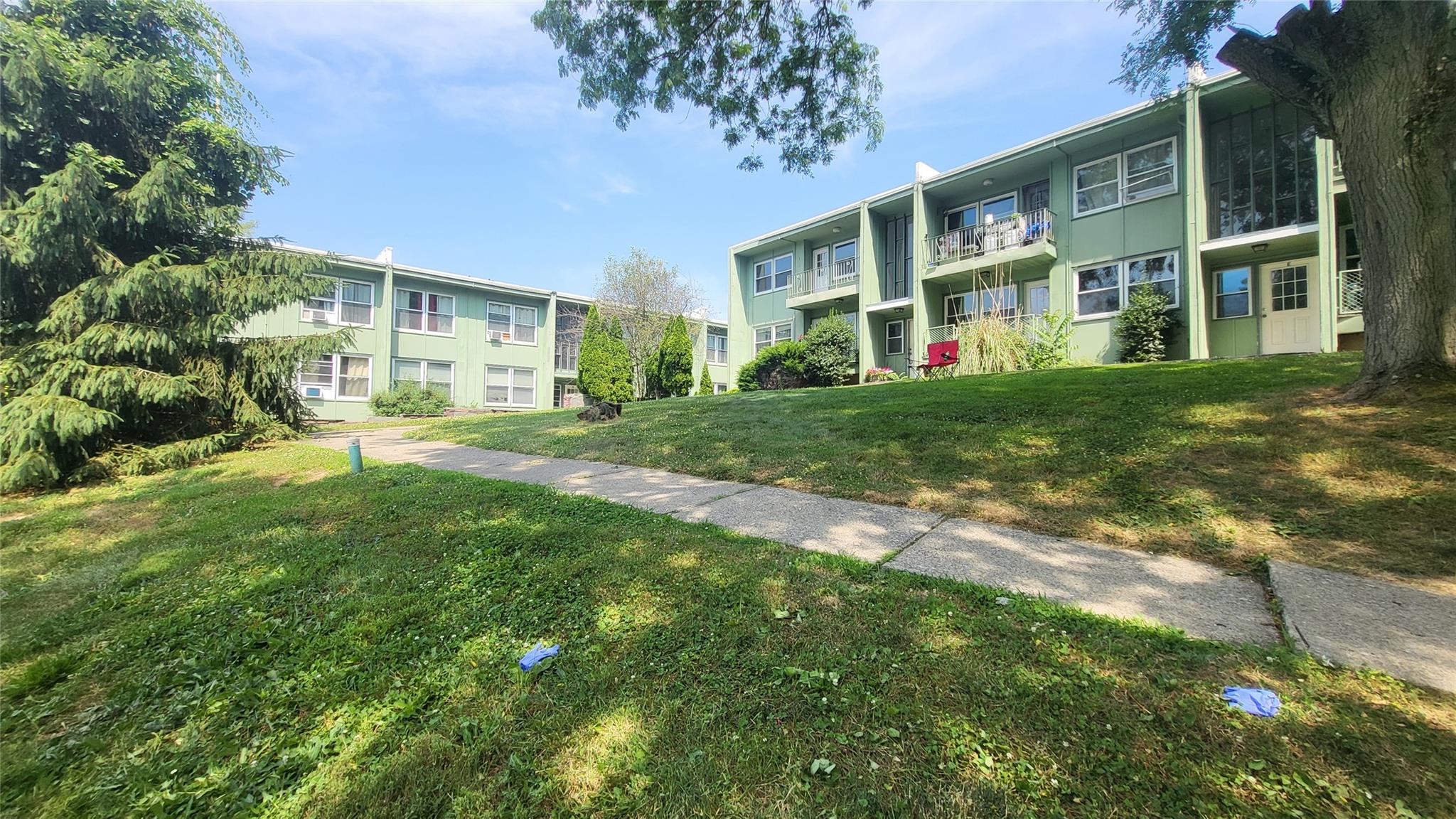 View of community featuring a lawn