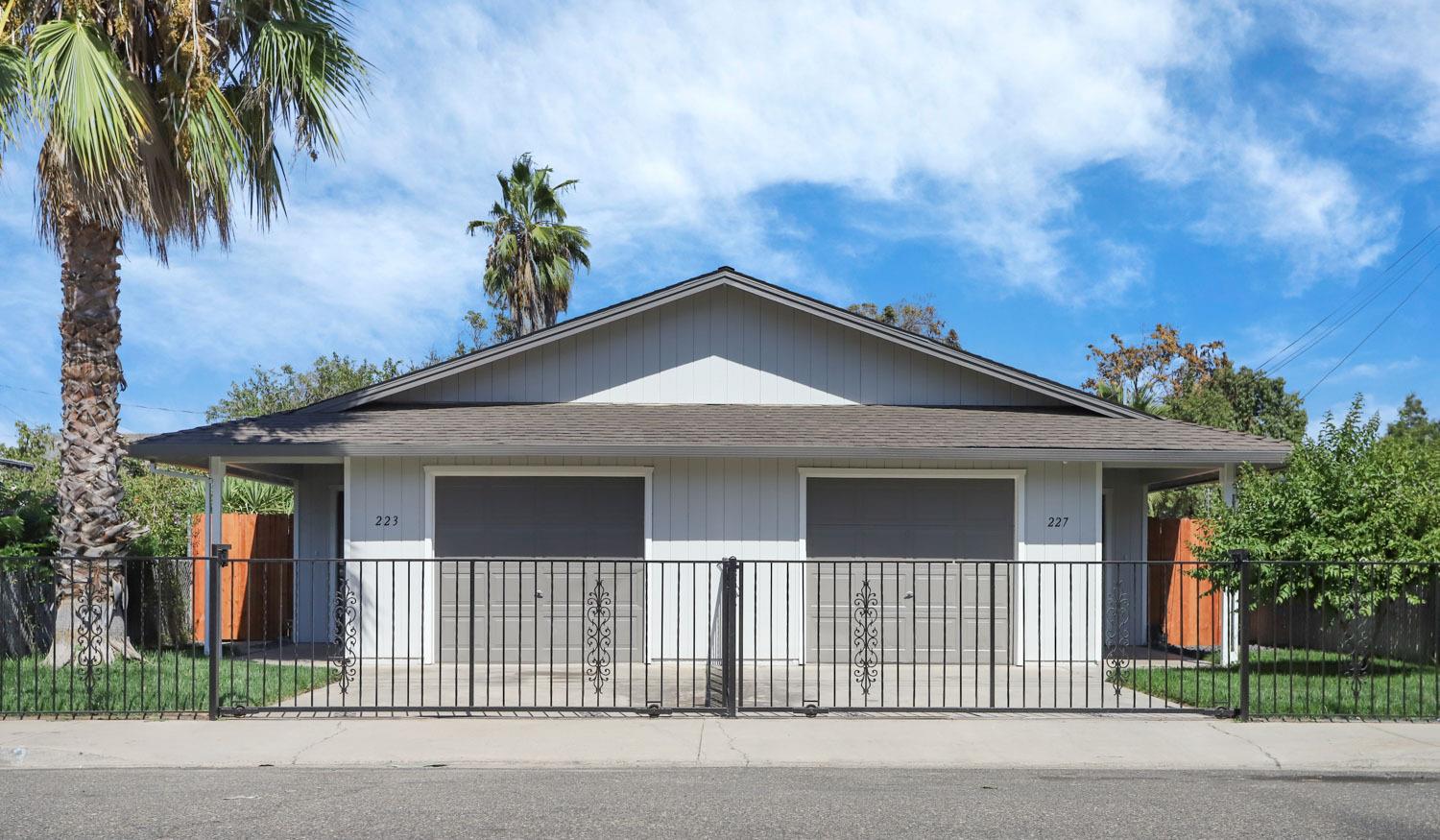 a front view of a house with a garage