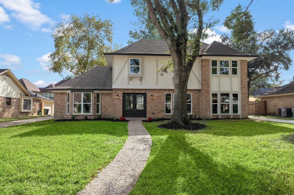 front view of a house and a yard