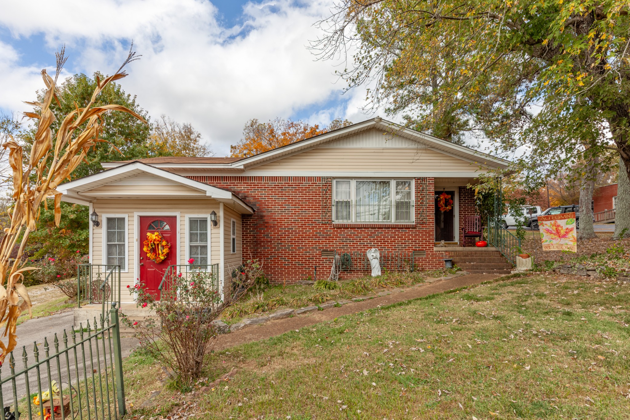 a front view of a house with garden