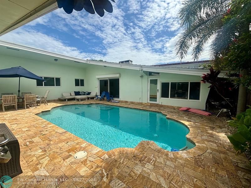 a view of a house with swimming pool