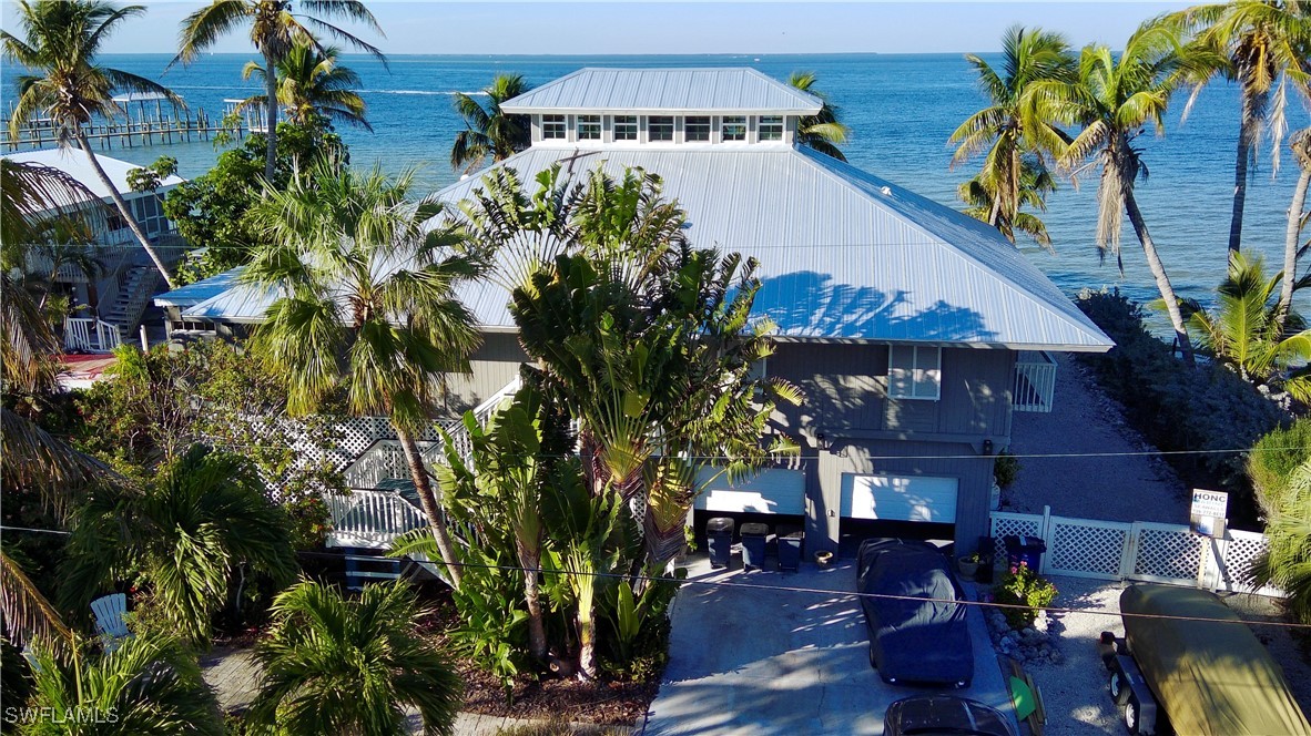 a aerial view of a house with a yard