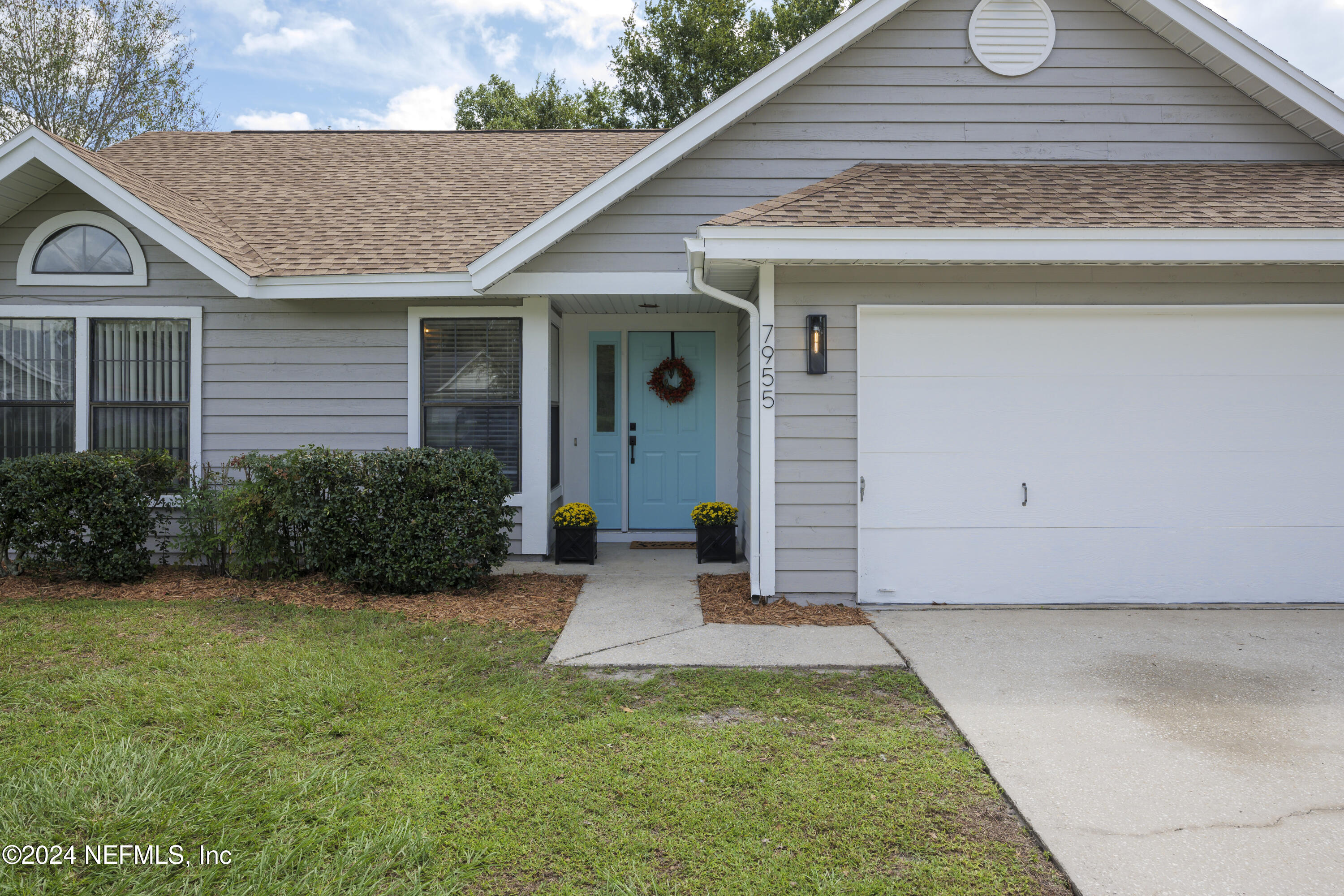 a front view of a house with a yard