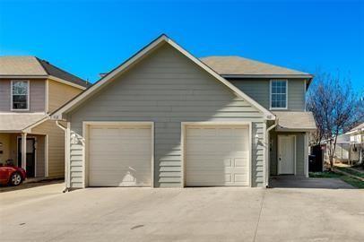 a front view of a house with garage