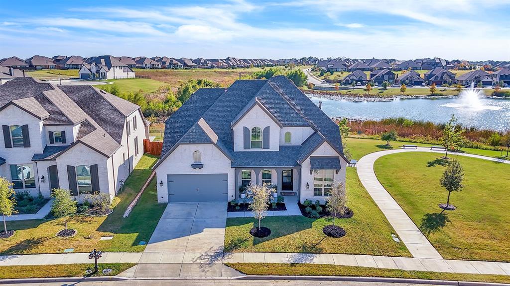 a aerial view of a house with swimming pool outdoor seating