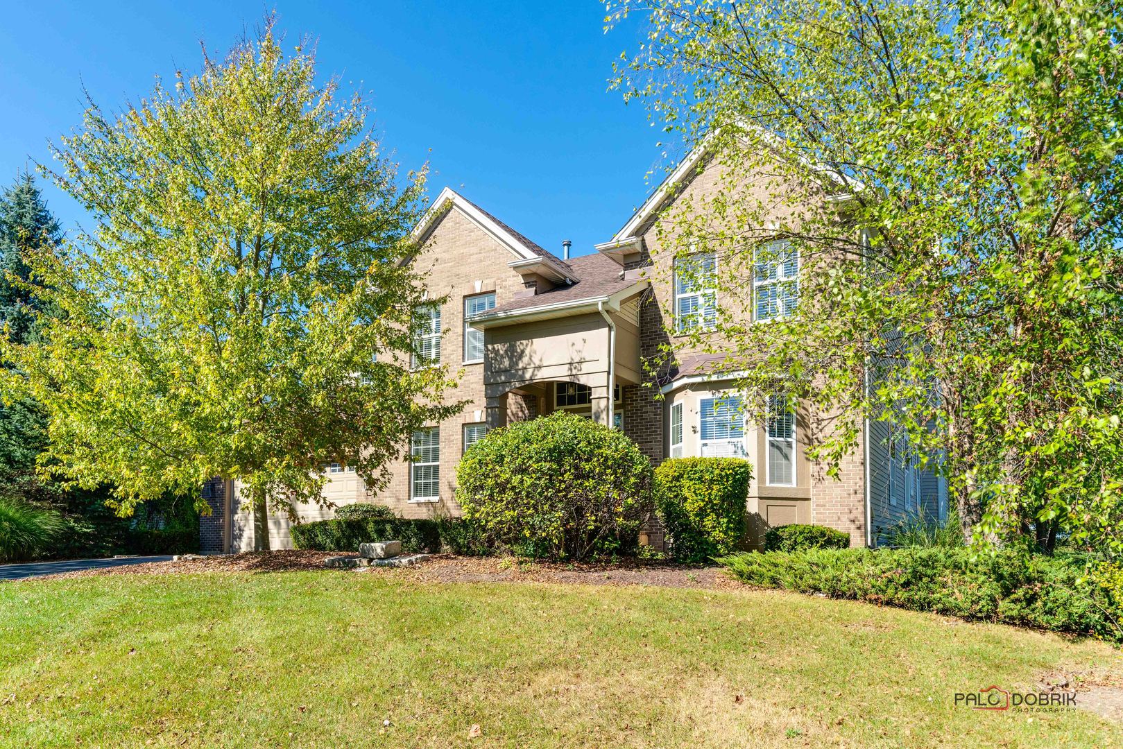 front view of a house with a yard