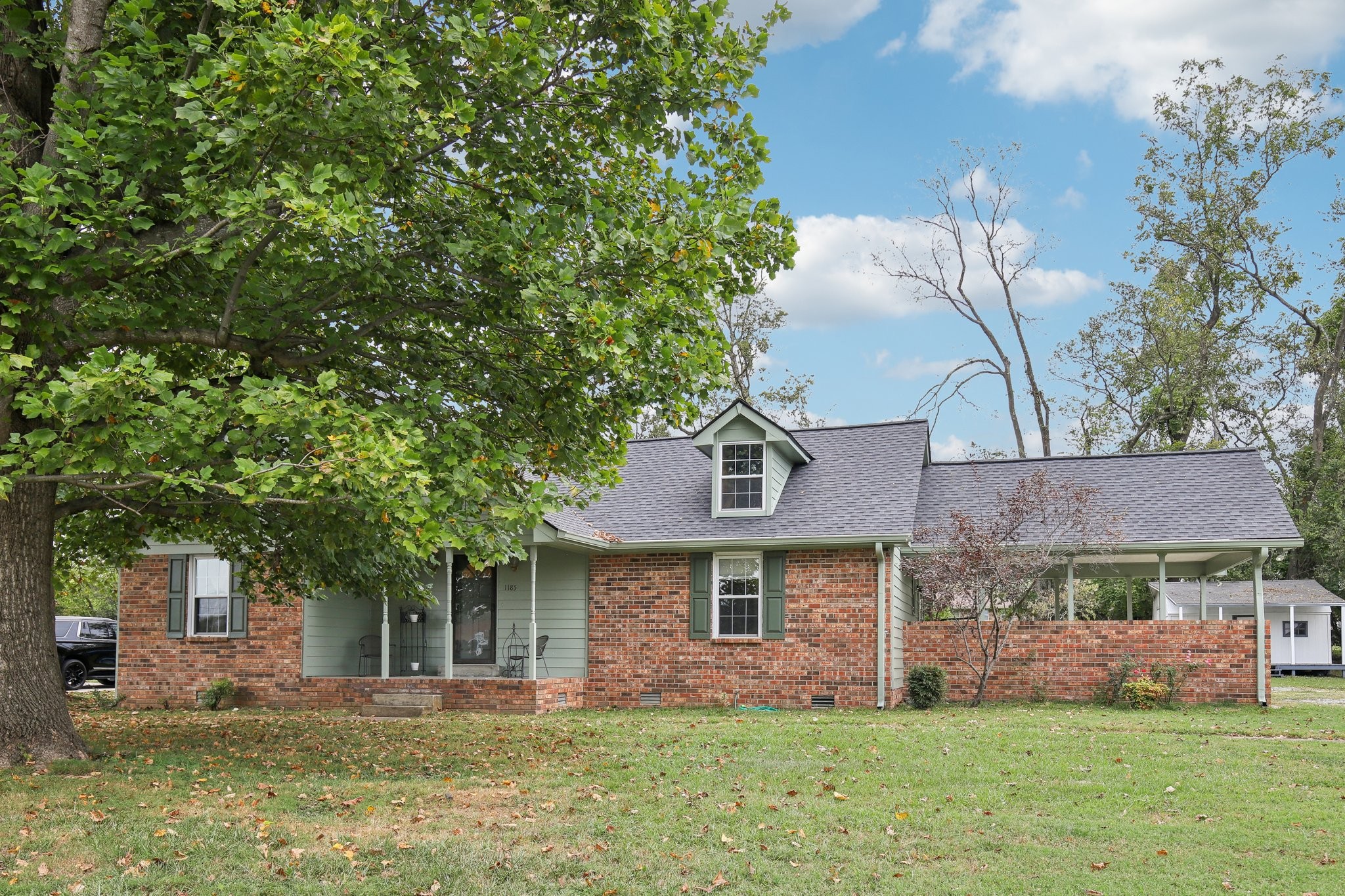 front view of a house with a yard