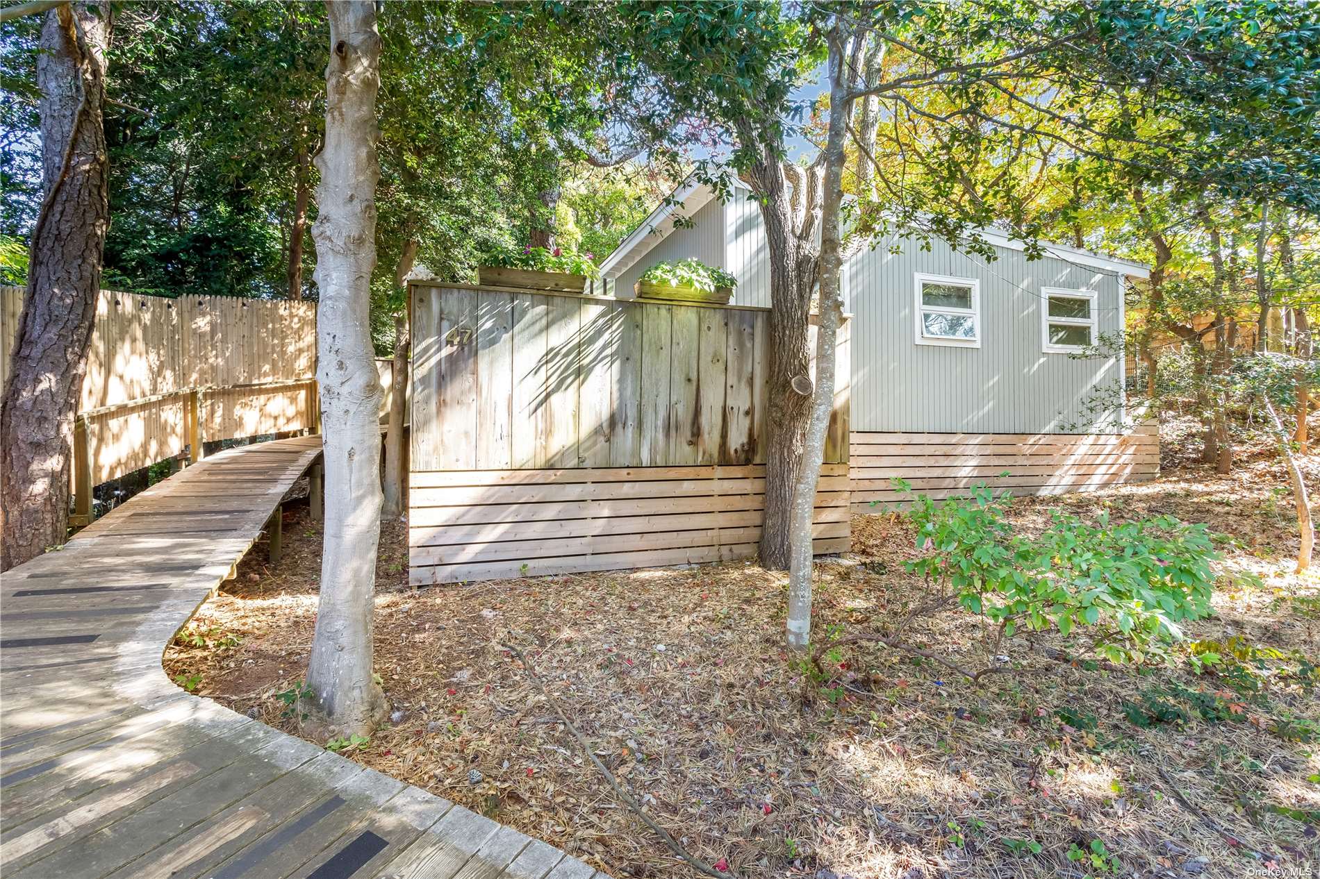 a view of a house with a tree