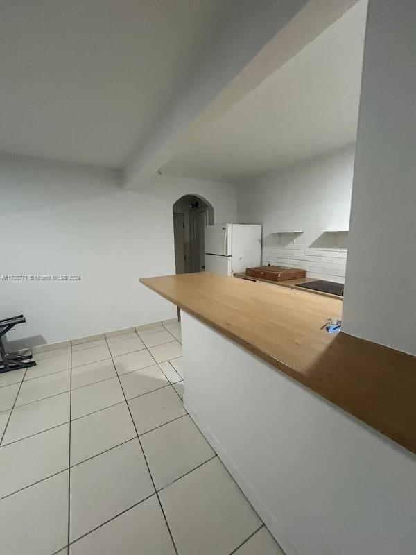 a kitchen with a sink cabinets and appliances