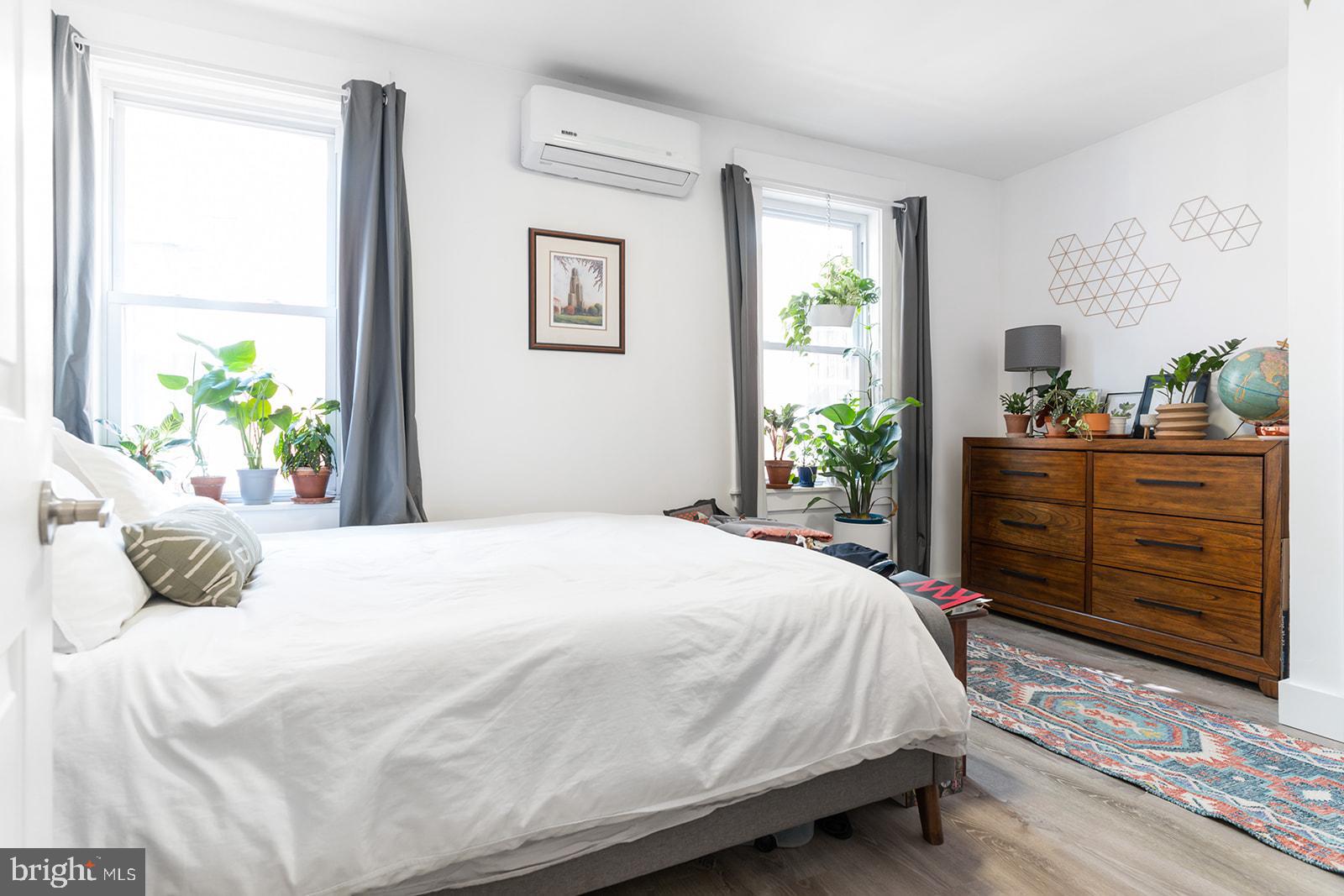 a bedroom with a bed and window