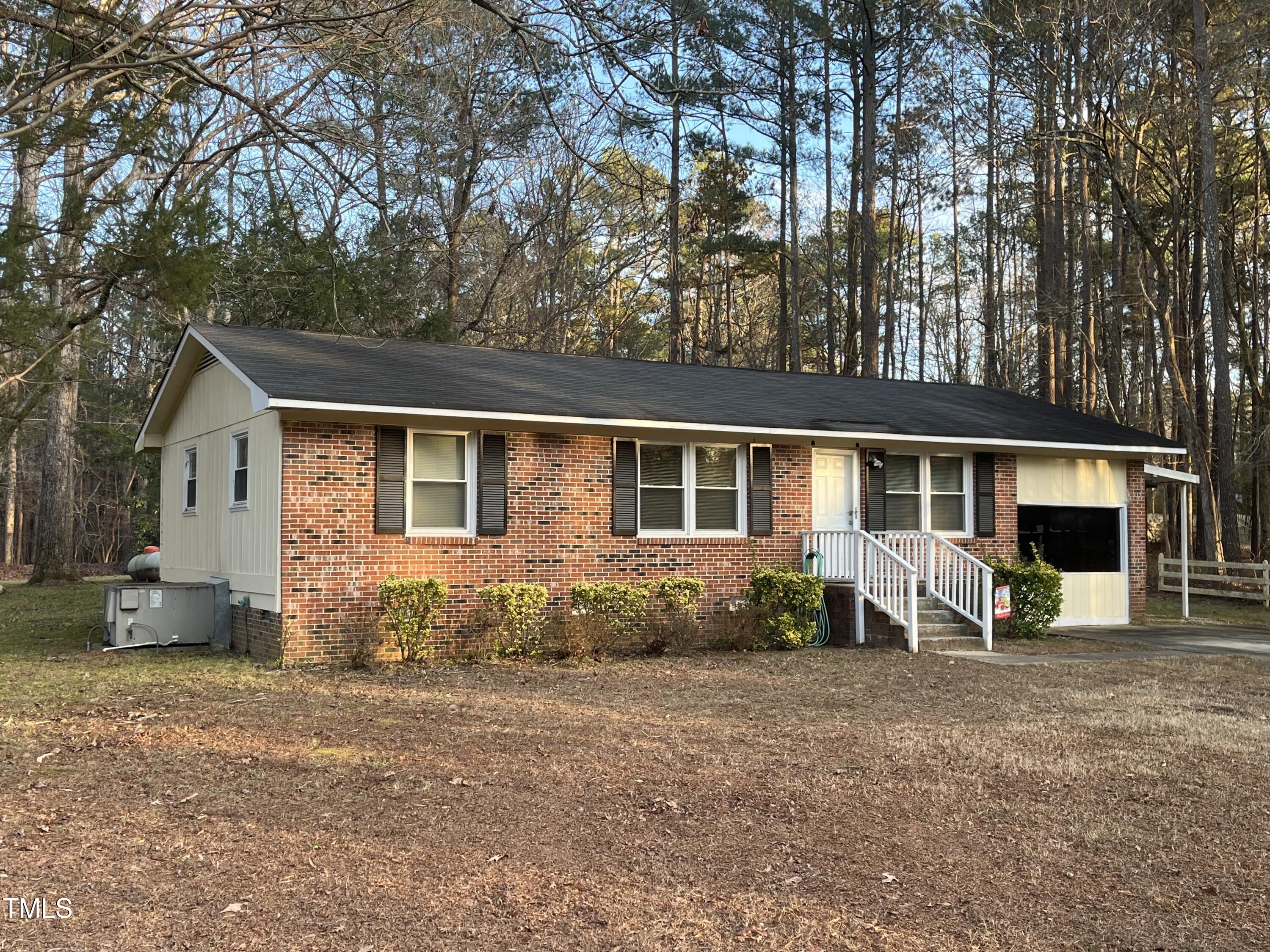 a front view of a house with sitting space