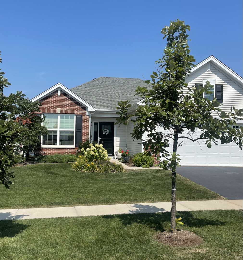 a front view of a house with a yard