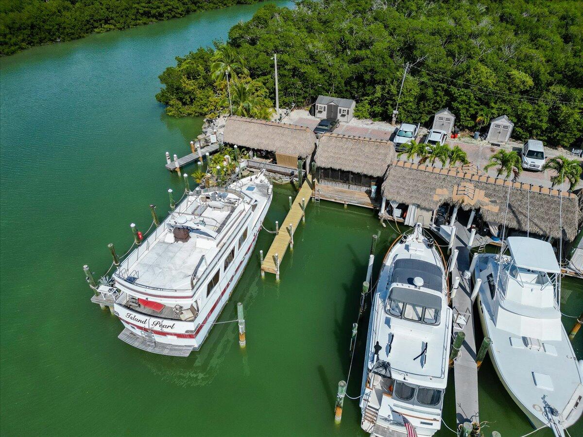 an aerial view of a house with outdoor space and lake view