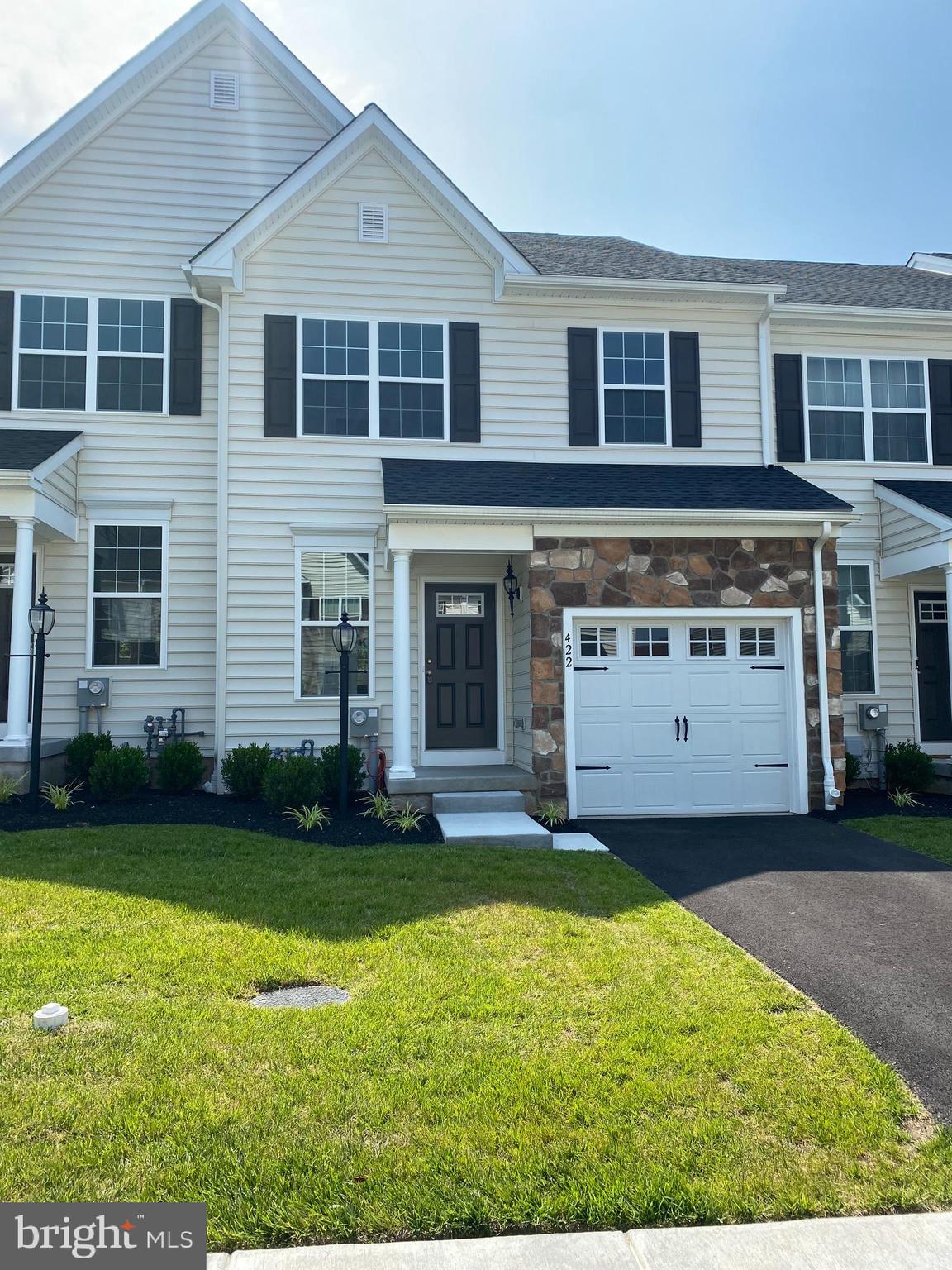 a view of a yard in front of a house