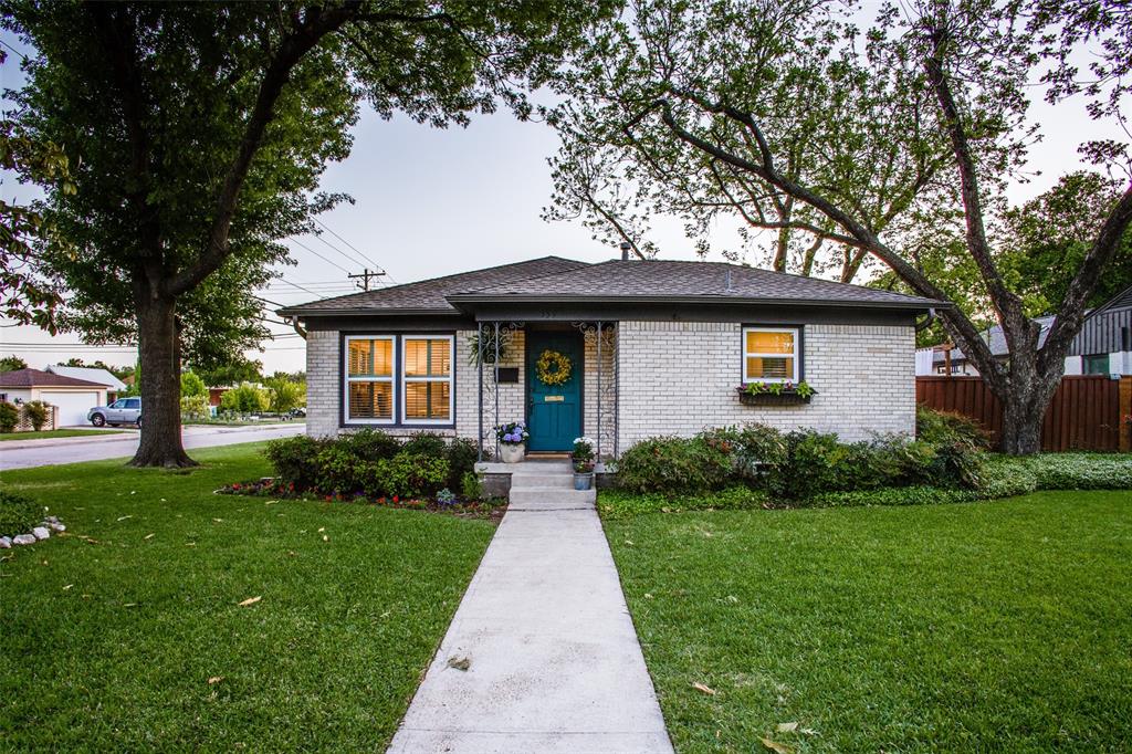 a front view of a house with yard