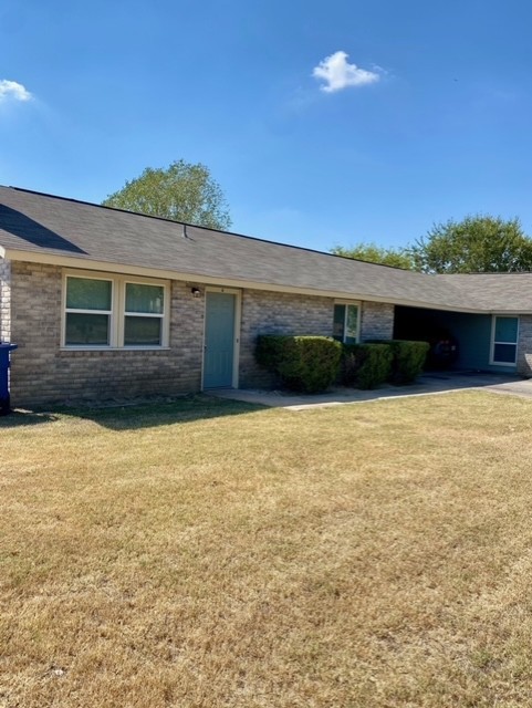 a view of house with yard