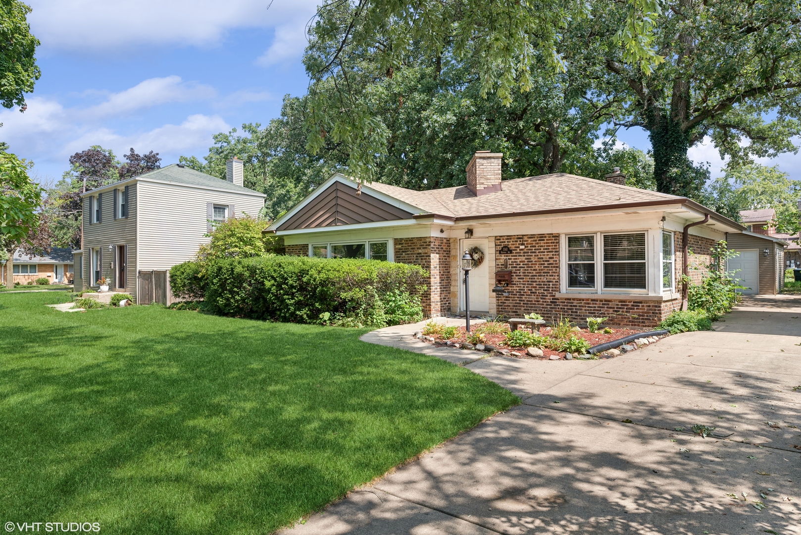 a front view of a house with a yard and porch