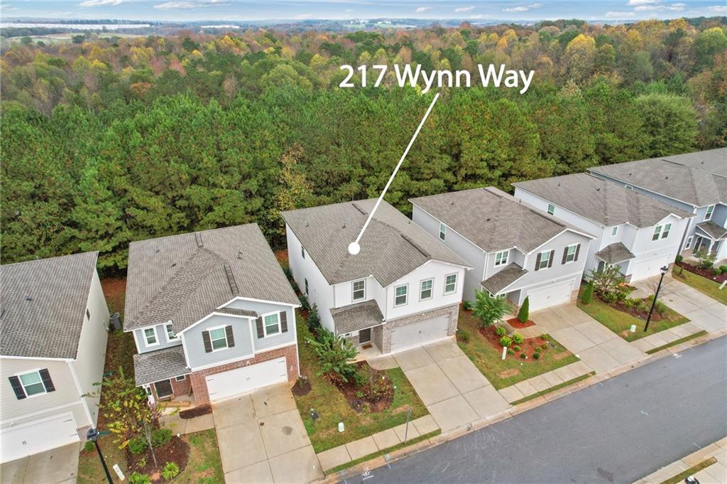 an aerial view of residential houses with outdoor space