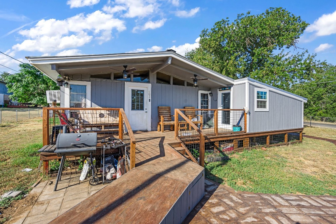 a view of a house with lounge chair and a patio