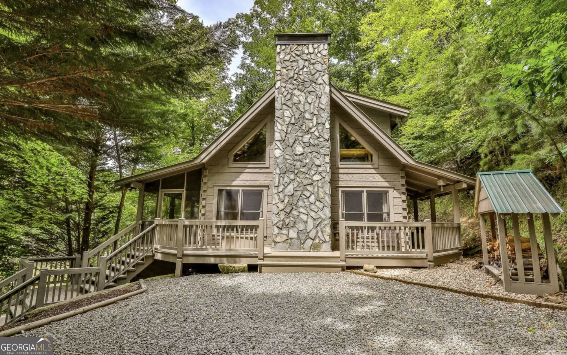 a view of a house with a backyard and a tree