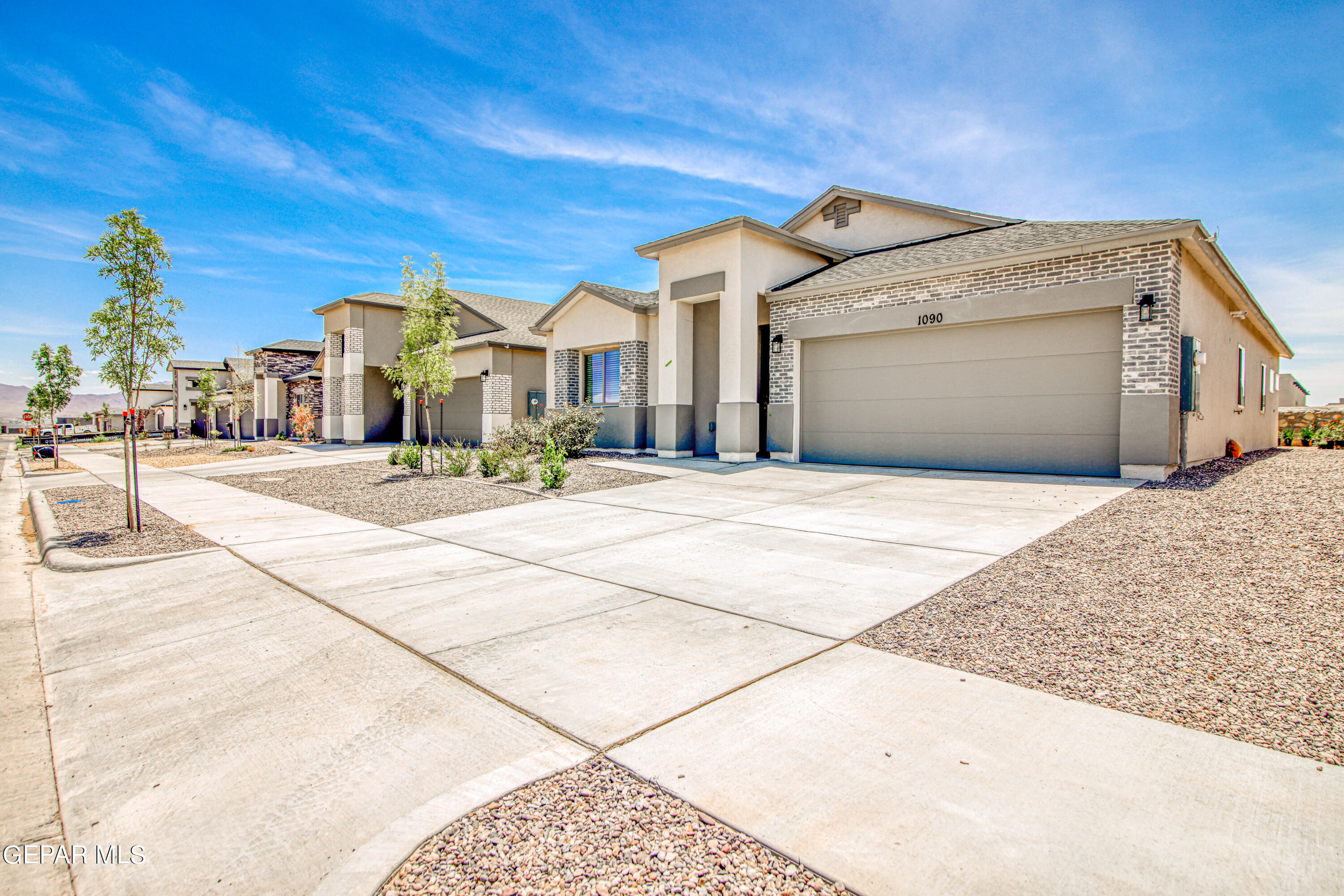 a front view of a house with a garage