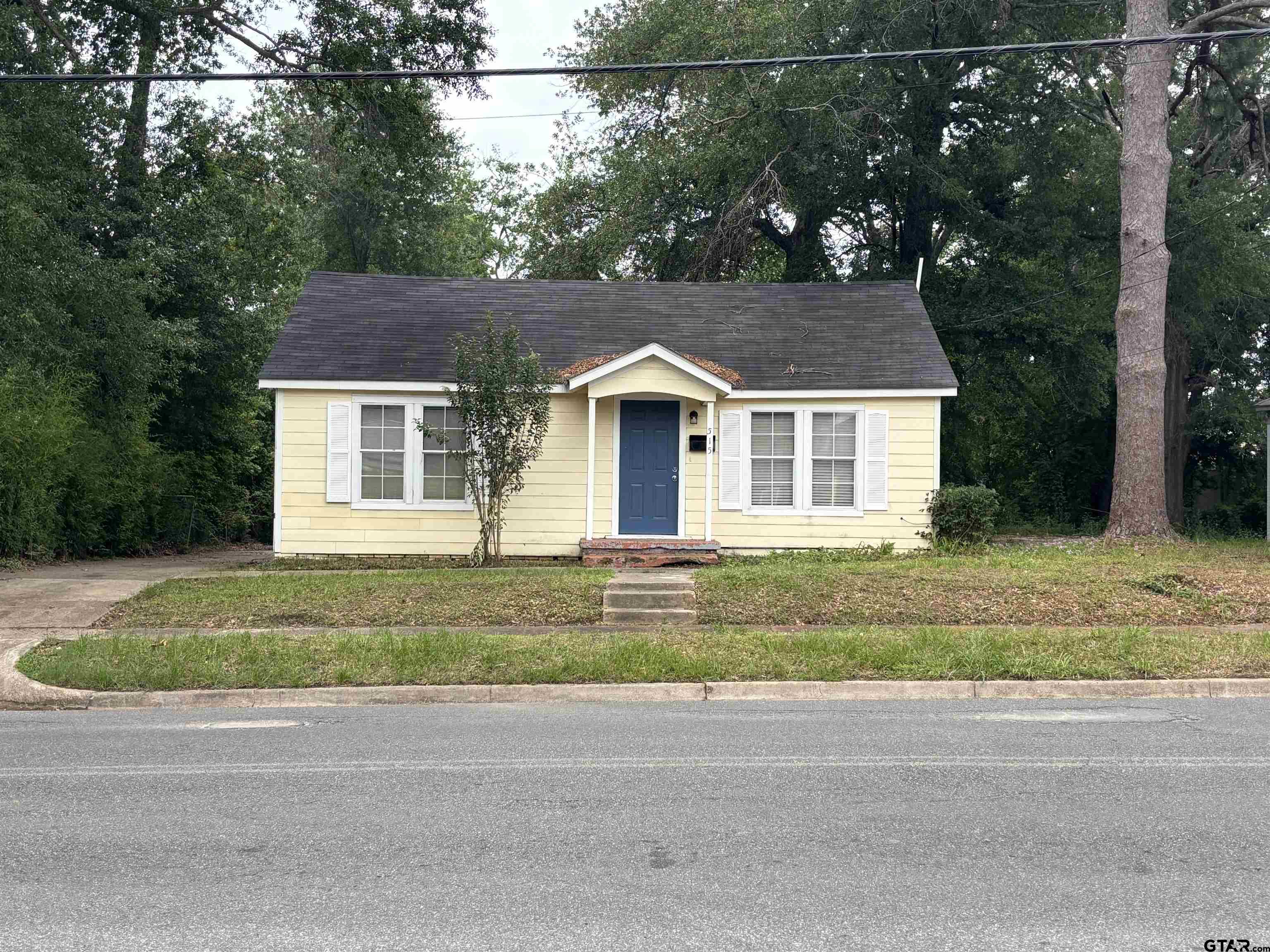 front view of a house and a yard