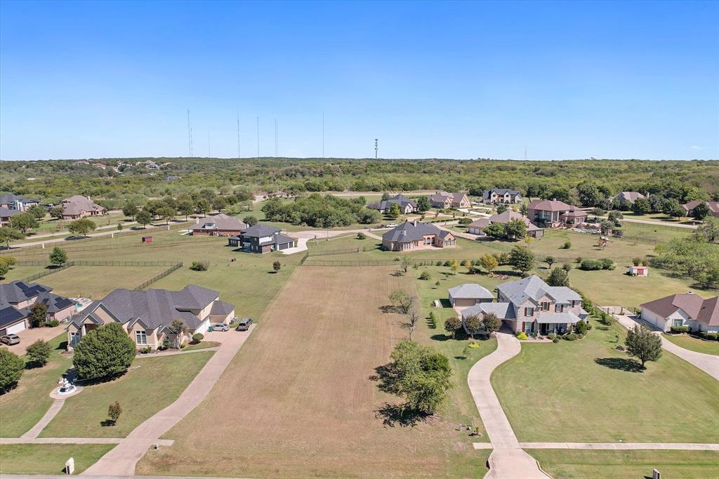 an aerial view of a houses with outdoor space