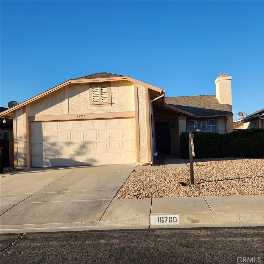 a front view of a house with garage