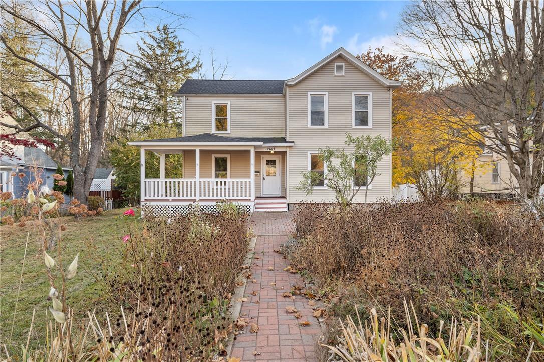 a view of a house with a yard