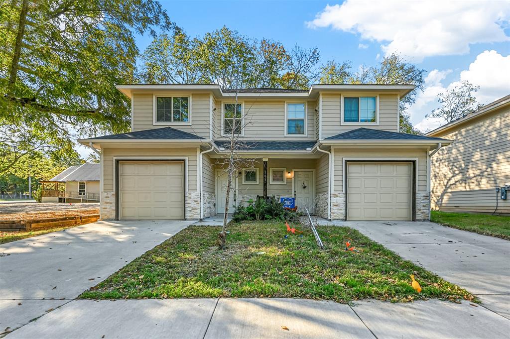 front view of a house with a yard