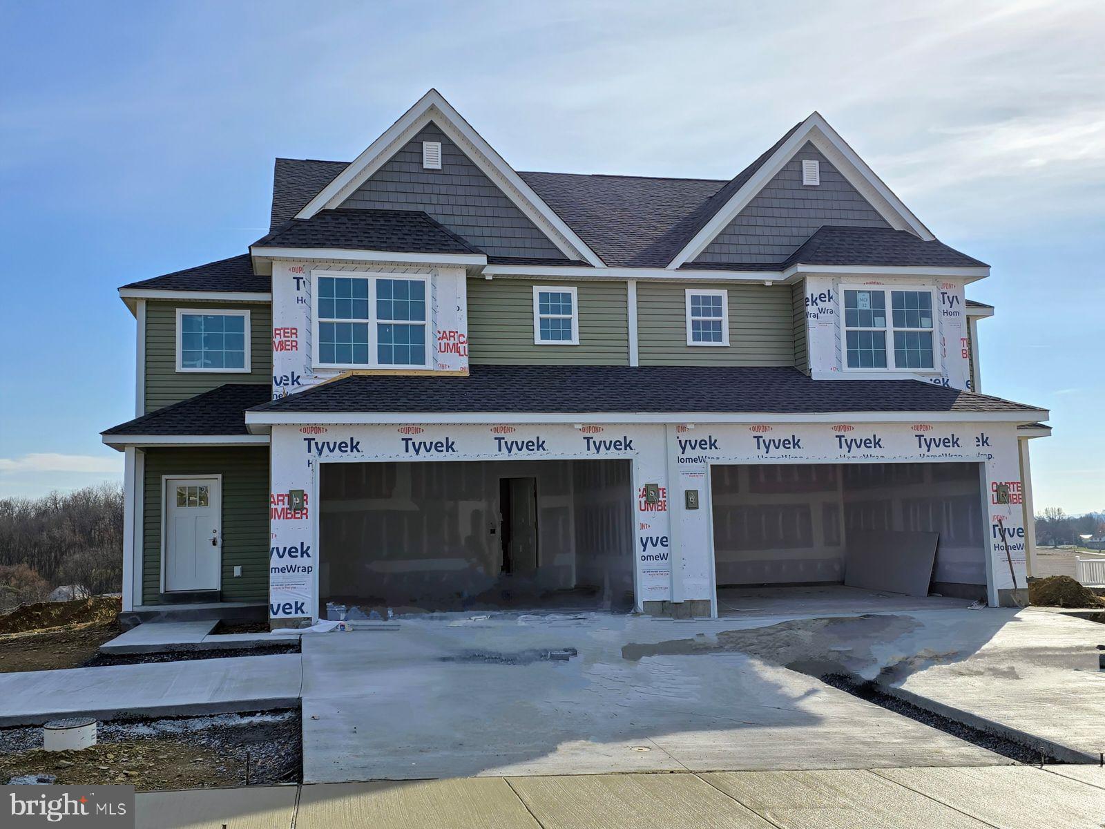 a front view of a house with yard