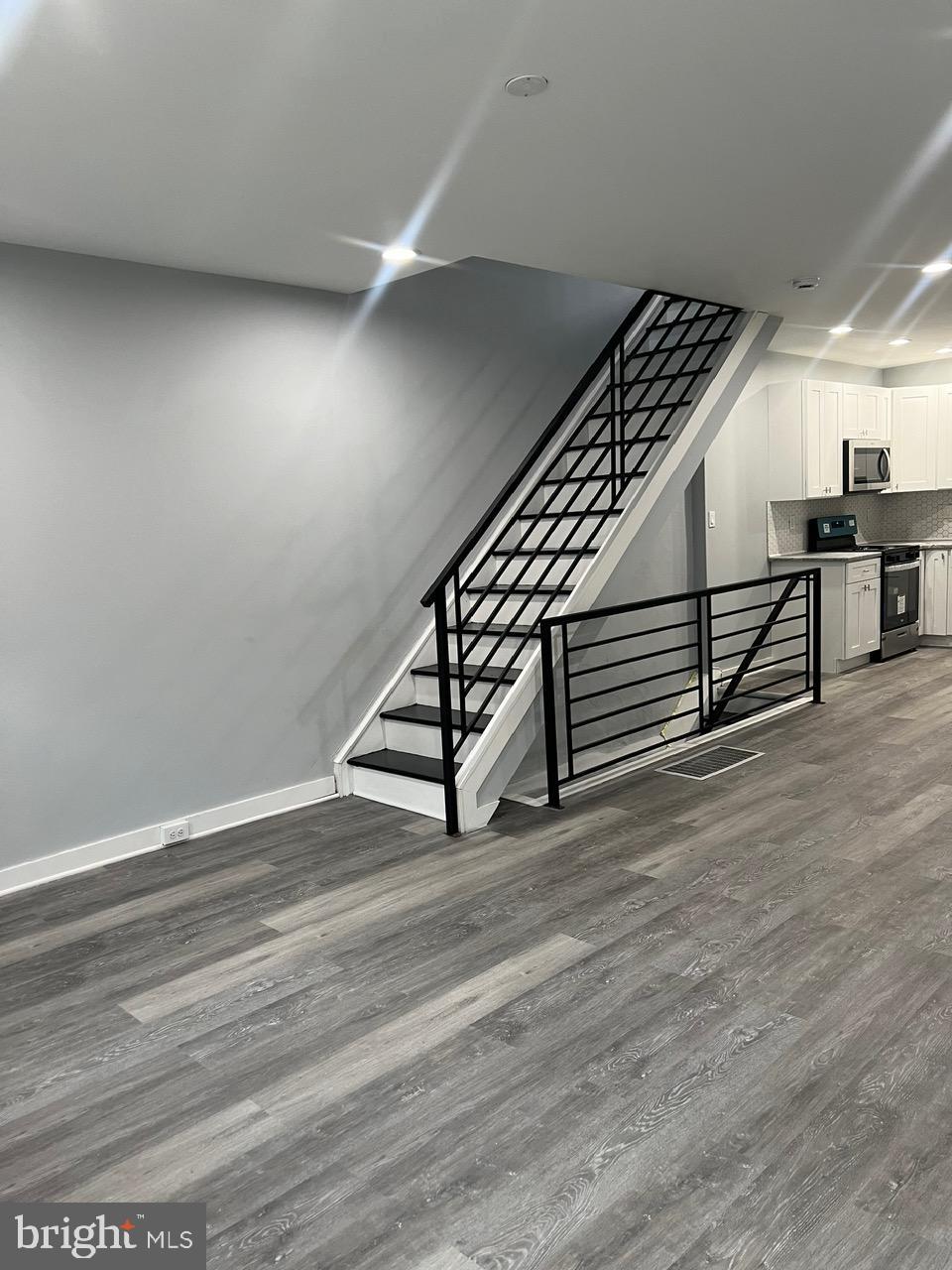 a view of an empty room with stairs