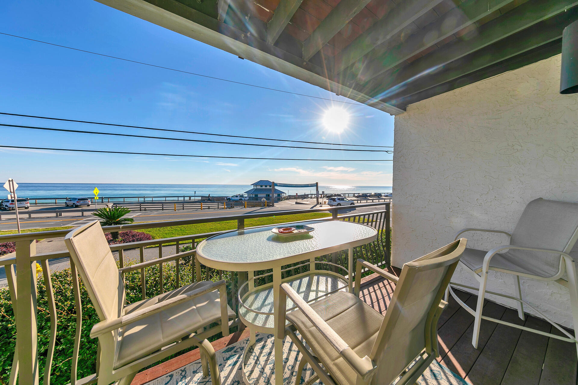 a view of a chairs and table in the balcony