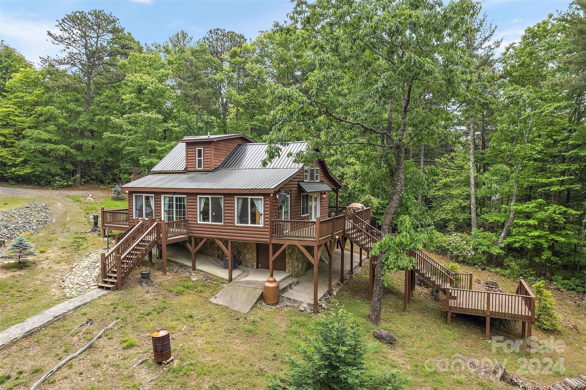 an aerial view of a house with a yard table and chairs