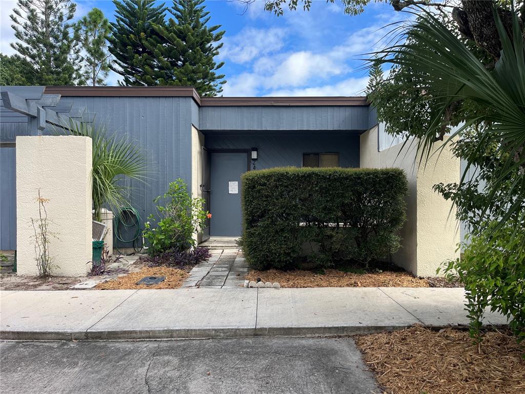 a view of a house with a yard and garage