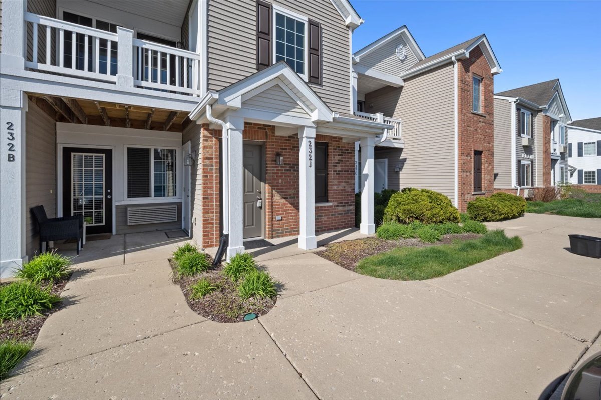 front view of a house with a small yard