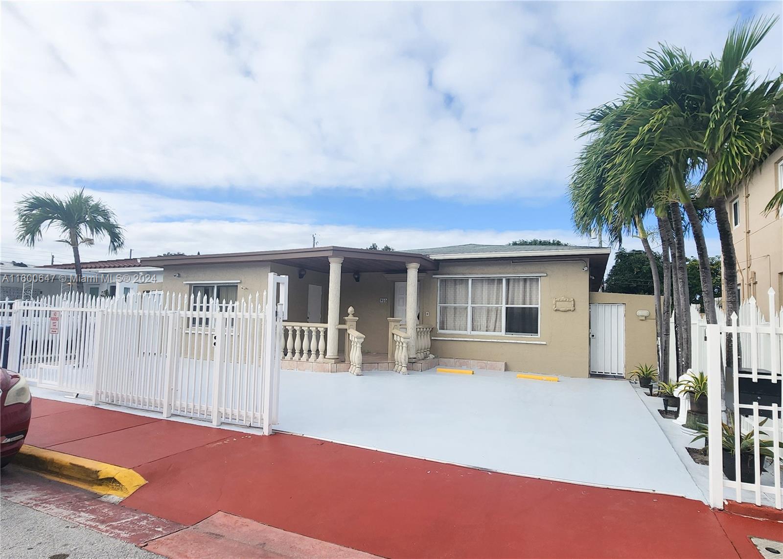 a front view of house with yard outdoor seating and barbeque oven