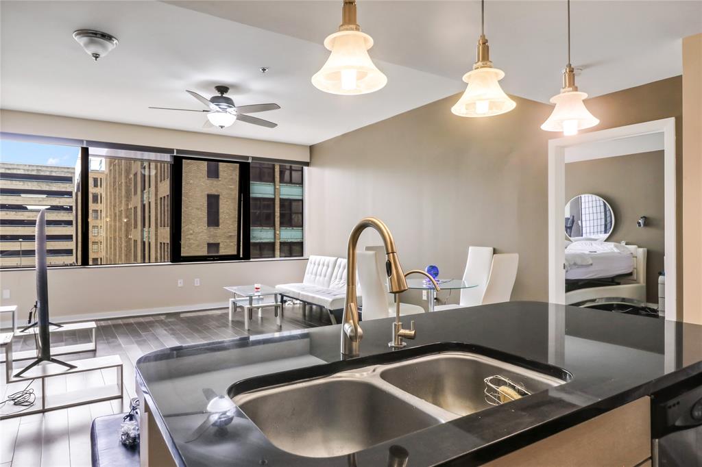 a kitchen with a sink and a chandelier