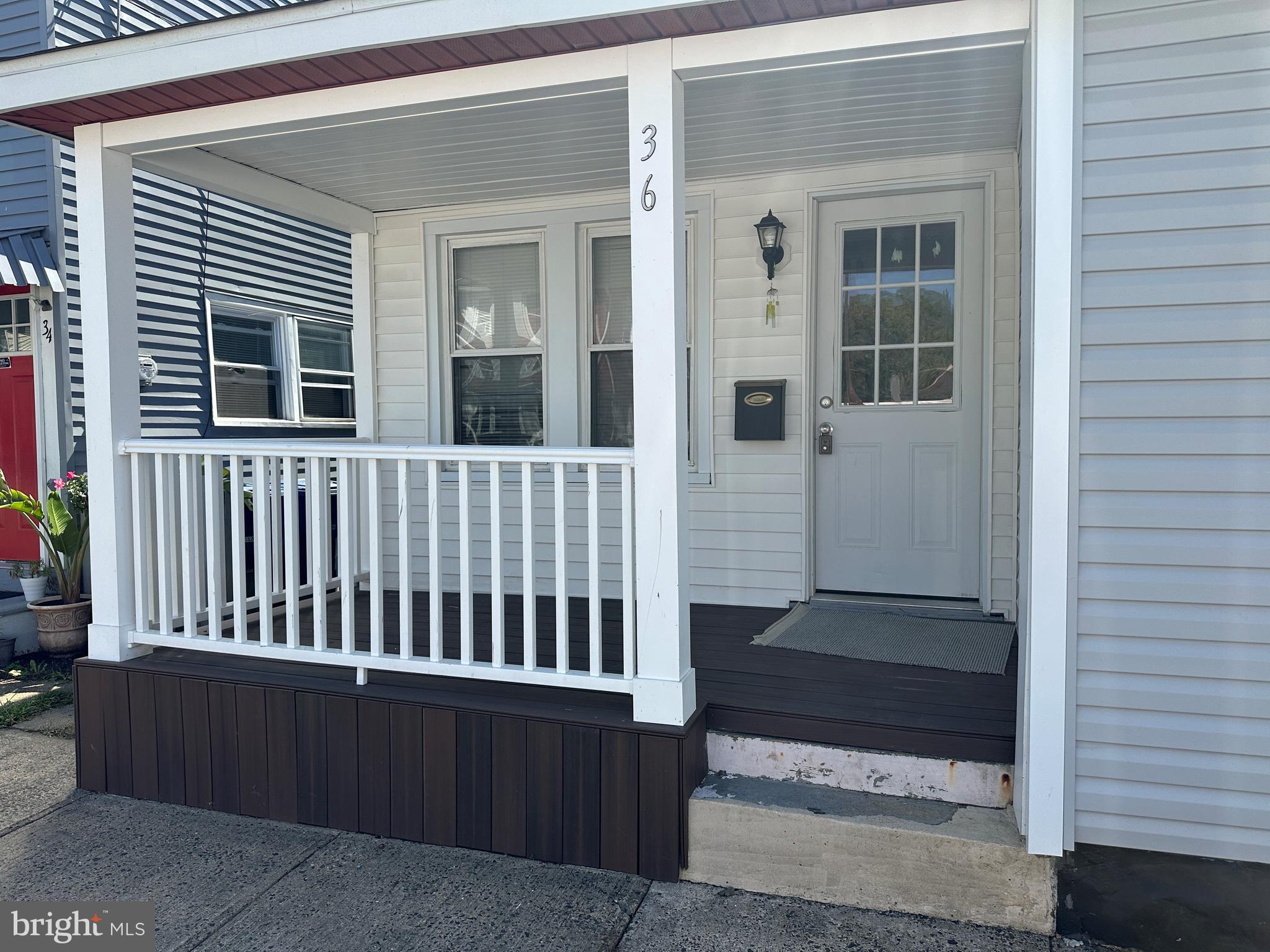 a view of porch with a bench