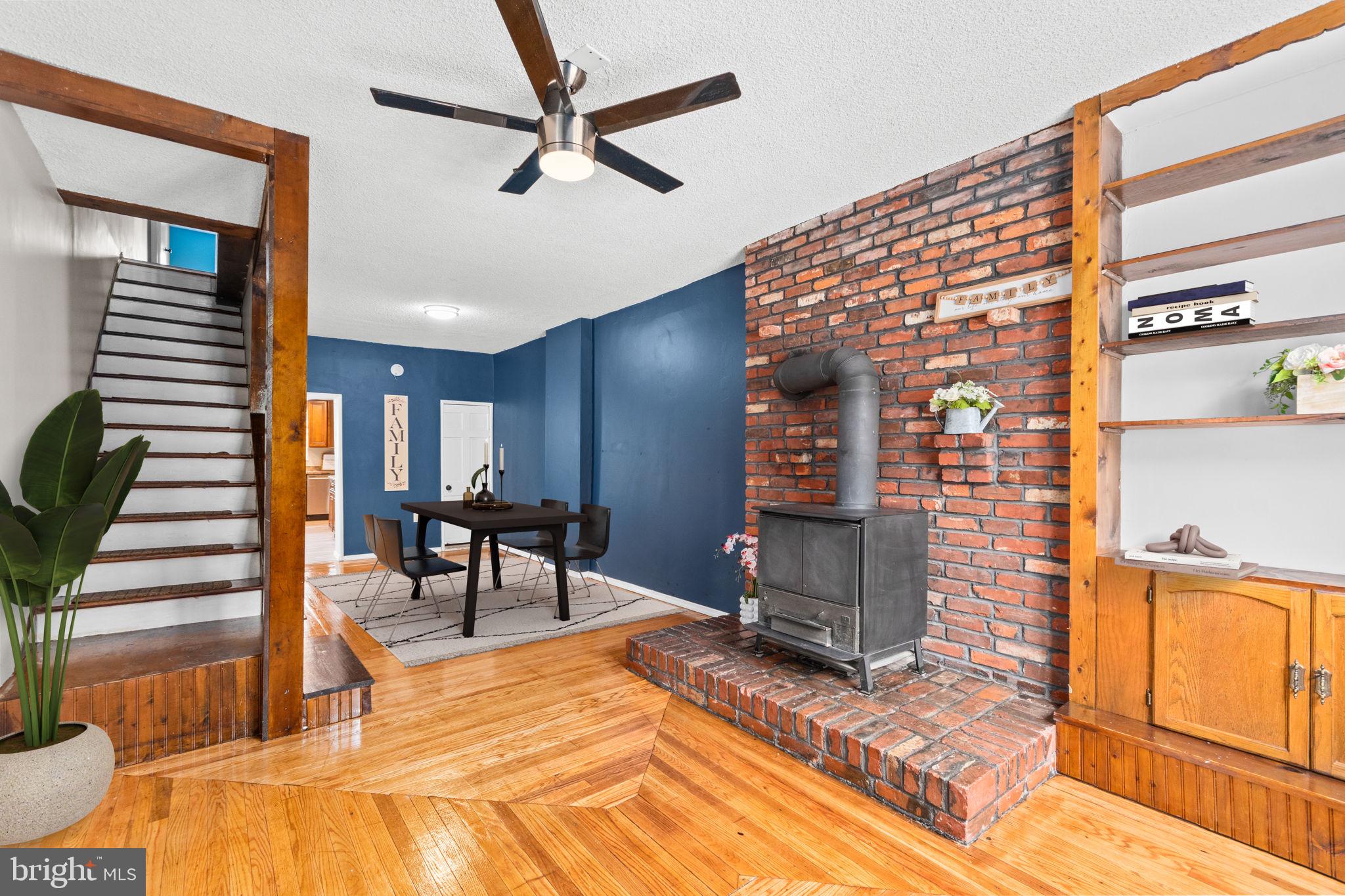 a view of a livingroom with furniture and staircase