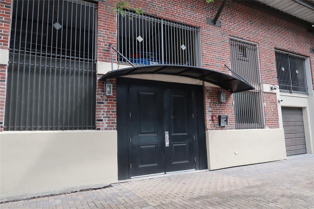 a front view of a house with parking space