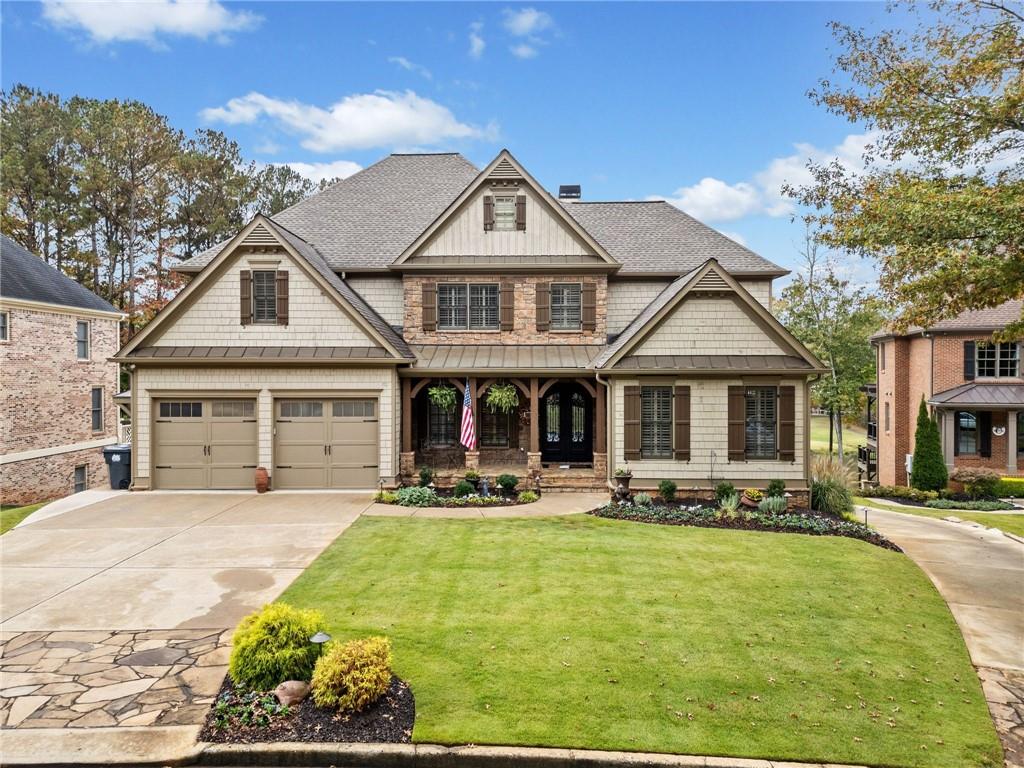 a front view of a house with a yard