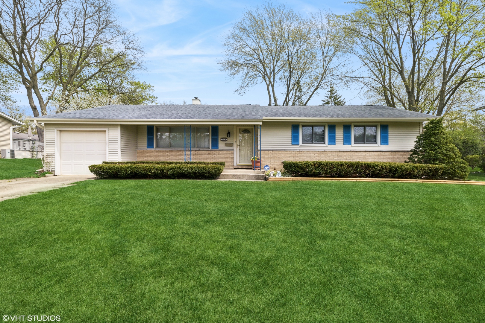 a front view of house with yard and green space