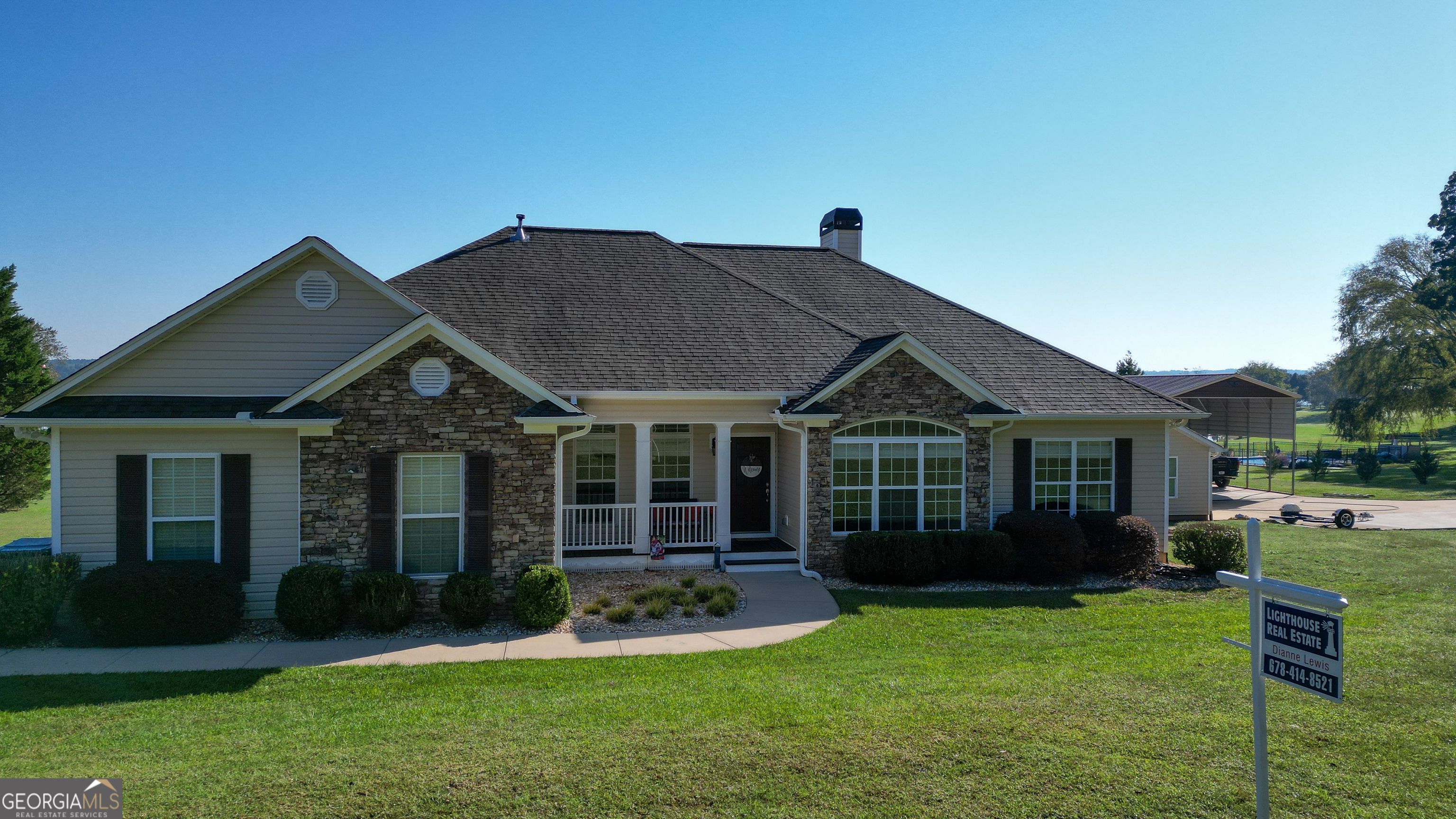 a view of a house with a yard and plants