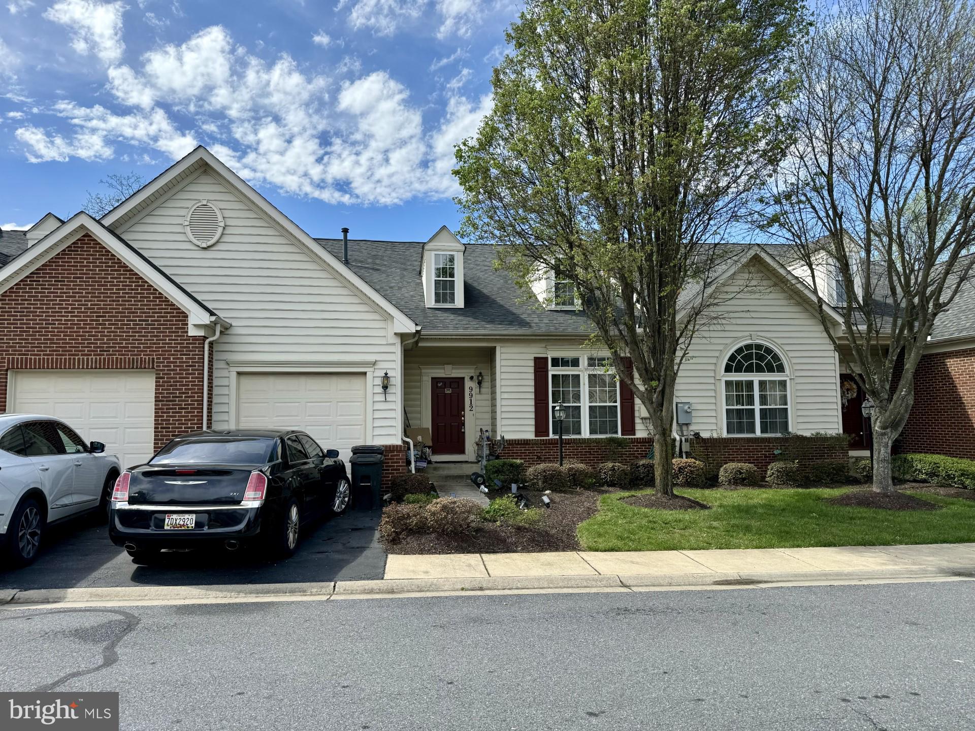 a view of a car park in front of house